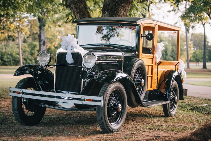 The couple left in the bride's uncle's refurbished 1930 Model A Ford Woody Wagon decorated with pretty white bows and a “Just Married” sign on the back.