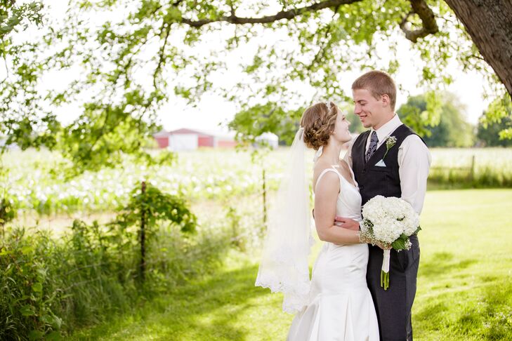 "Since I had no beading on the dress, I had a veil with a thick flower trim and a gem headpiece that gave me my sparkle," Bridget says. "I made the veil myself, since I love to sew and it was important to me that it draped over my face as I walked down the aisle."