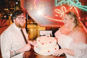 Couple at Retro-Themed Elopement Party With Heart-Shaped Cake