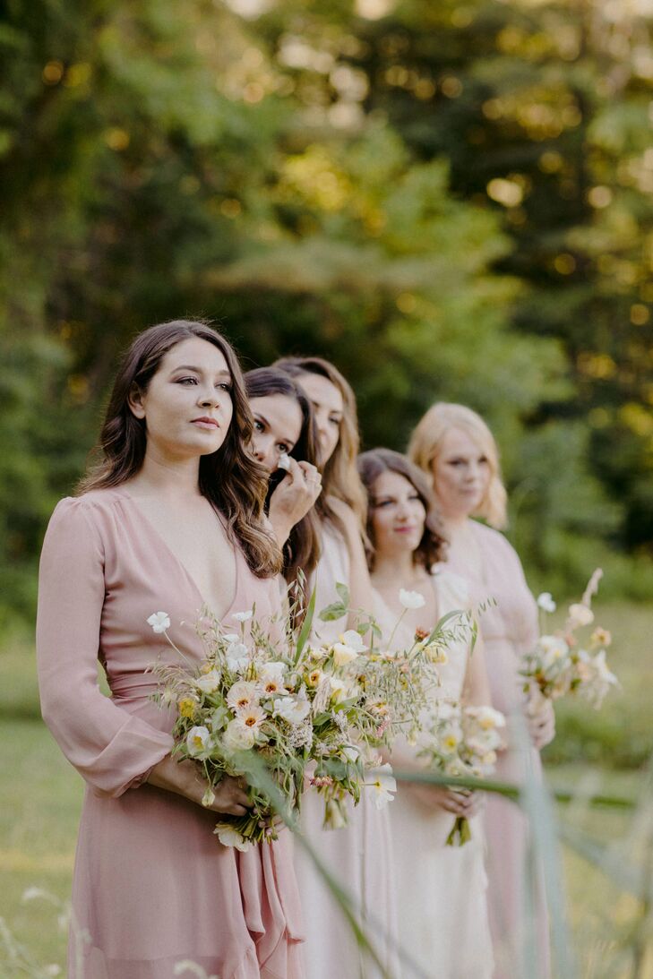 Romantic Bridesmaids with Pink Dresses and Whimsical Bouquets