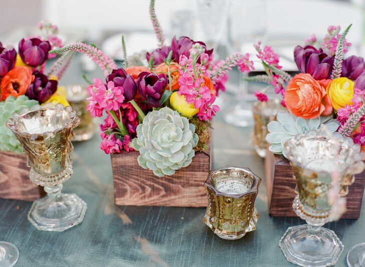 Gold-textured votive candles shimmered against the table linen.