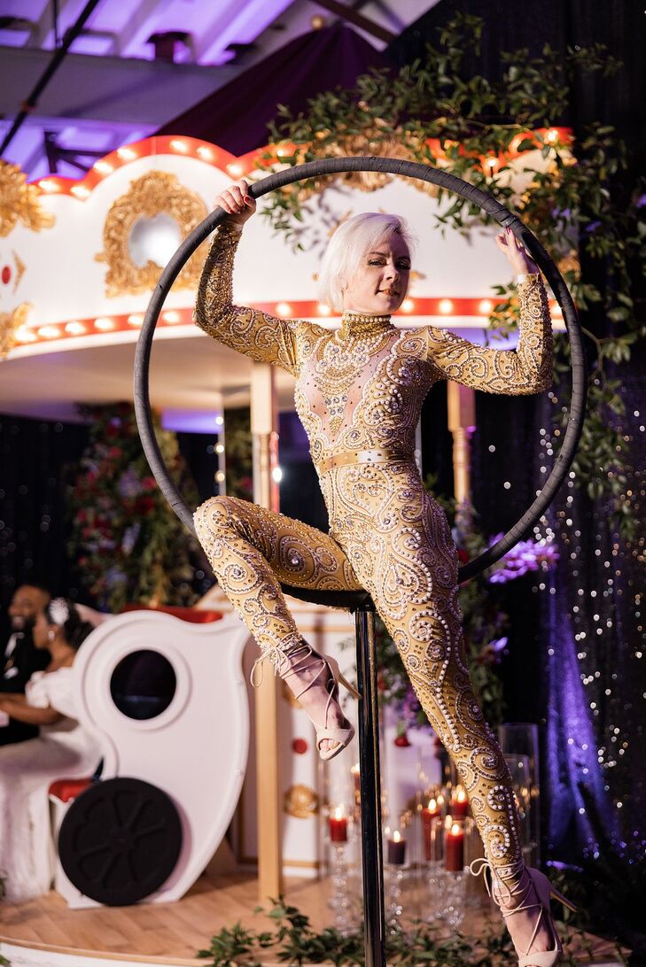 Acrobat in Gold Bodysuit at Carnival-Themed Wedding