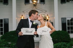 Bride and Groom Hold "Thank You" Signs
