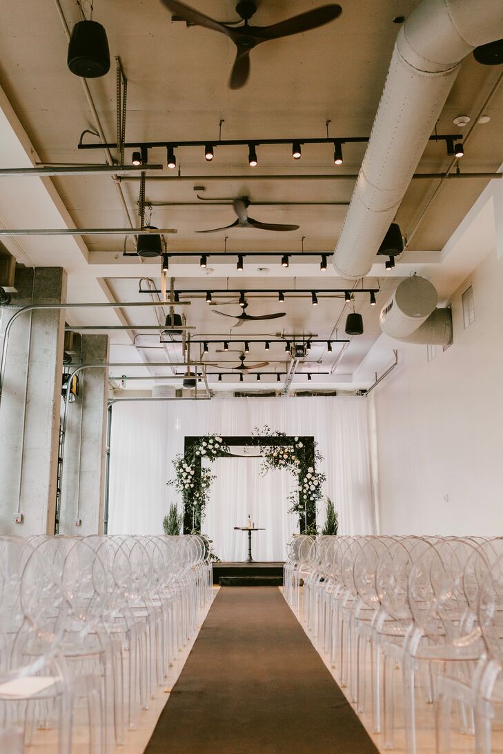 Modern Industrial Loft Ceremony with Ghost Chairs and Chuppah at The Ben in West Palm Beach, Florida