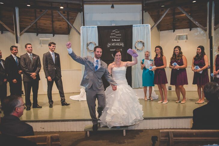 Newlyweds Throw Arms Up in Celebration of Their Nuptials