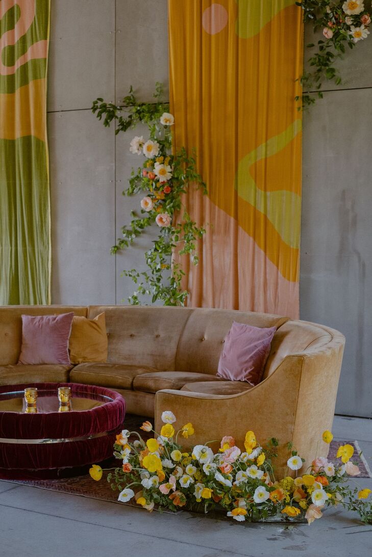 Retro 1970s Lounge Setup With Velvet Details and Colorful DIY Art Backdrops