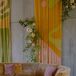 Retro 1970s Lounge Setup With Velvet Details and Colorful DIY Art Backdrops