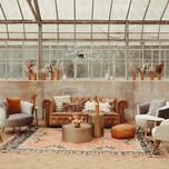 wedding lounge furniture with neon sign that says hakuna matata
