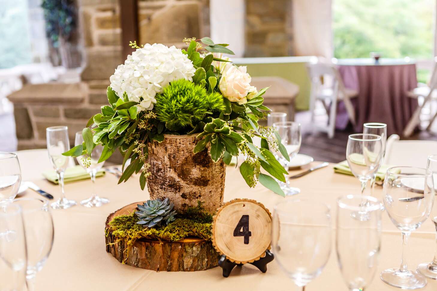 Birch Wood Centerpieces with Hydrangeas and Greenery and Wood Slab Table  Numbers