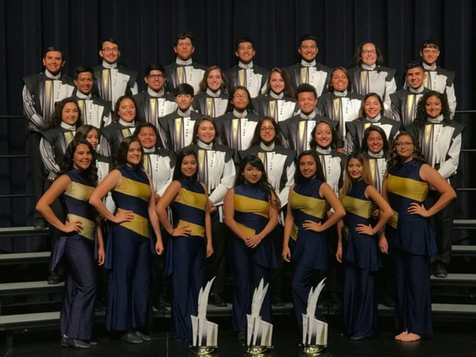 Marching band yearbook photo of all the seniors. If only we knew how close our future spouses were in this photo..