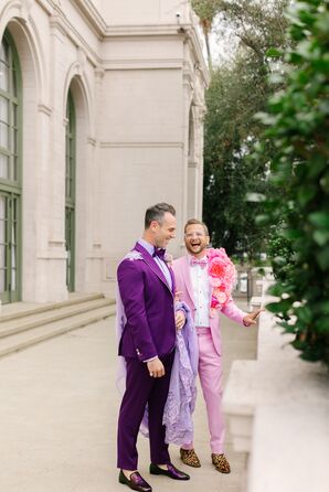 Grooms in Bold, Jewel-Tone Tuxedos With Floral Lapel and Tulle Cape Laugh During First Look