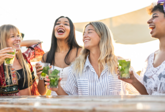 Women on bachelorette trip having drinks