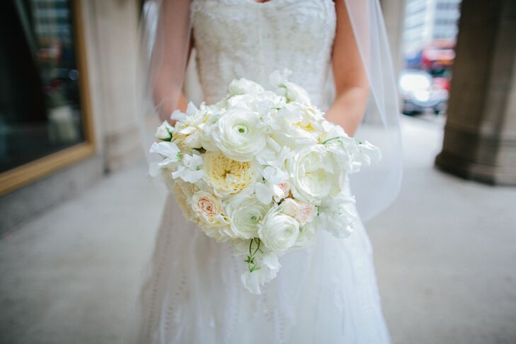 Liz carried a classic, lush bouquet filled with ivory ranunculus, white garden roses, dusty miller and hydrangeas.