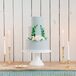 Blue-Gray Tiered Wedding Cake with Elegant Laurel Wreath Design