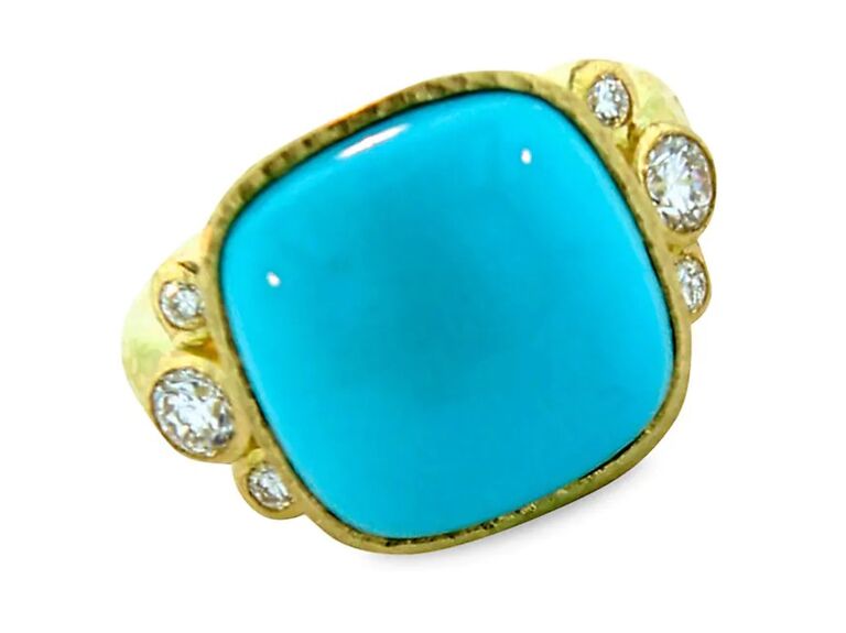 Square turquoise stone with gold band and diamond embellishments