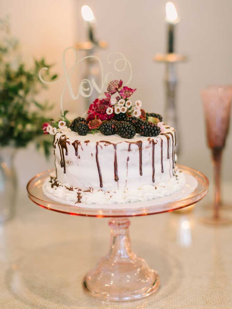 Small semi-naked wedding cake with chocolate drip