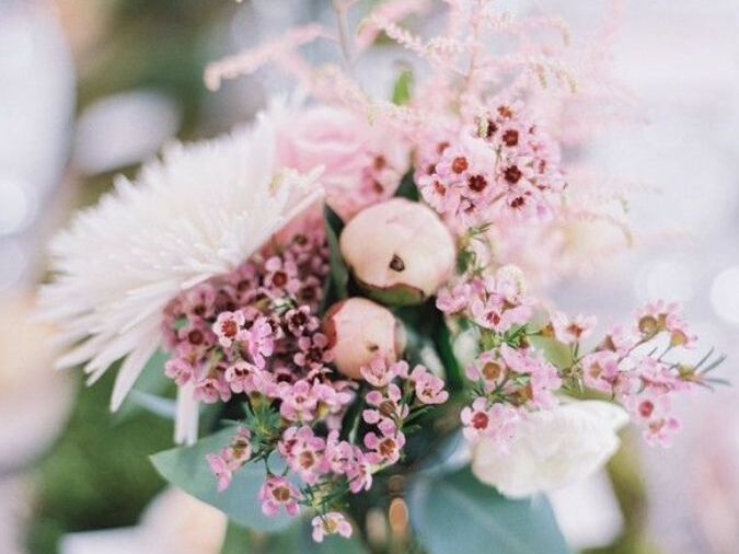 Pink wax flower blooms in wedding centerpiece