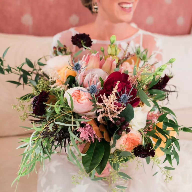 Pastel protea wedding bouquet with roses