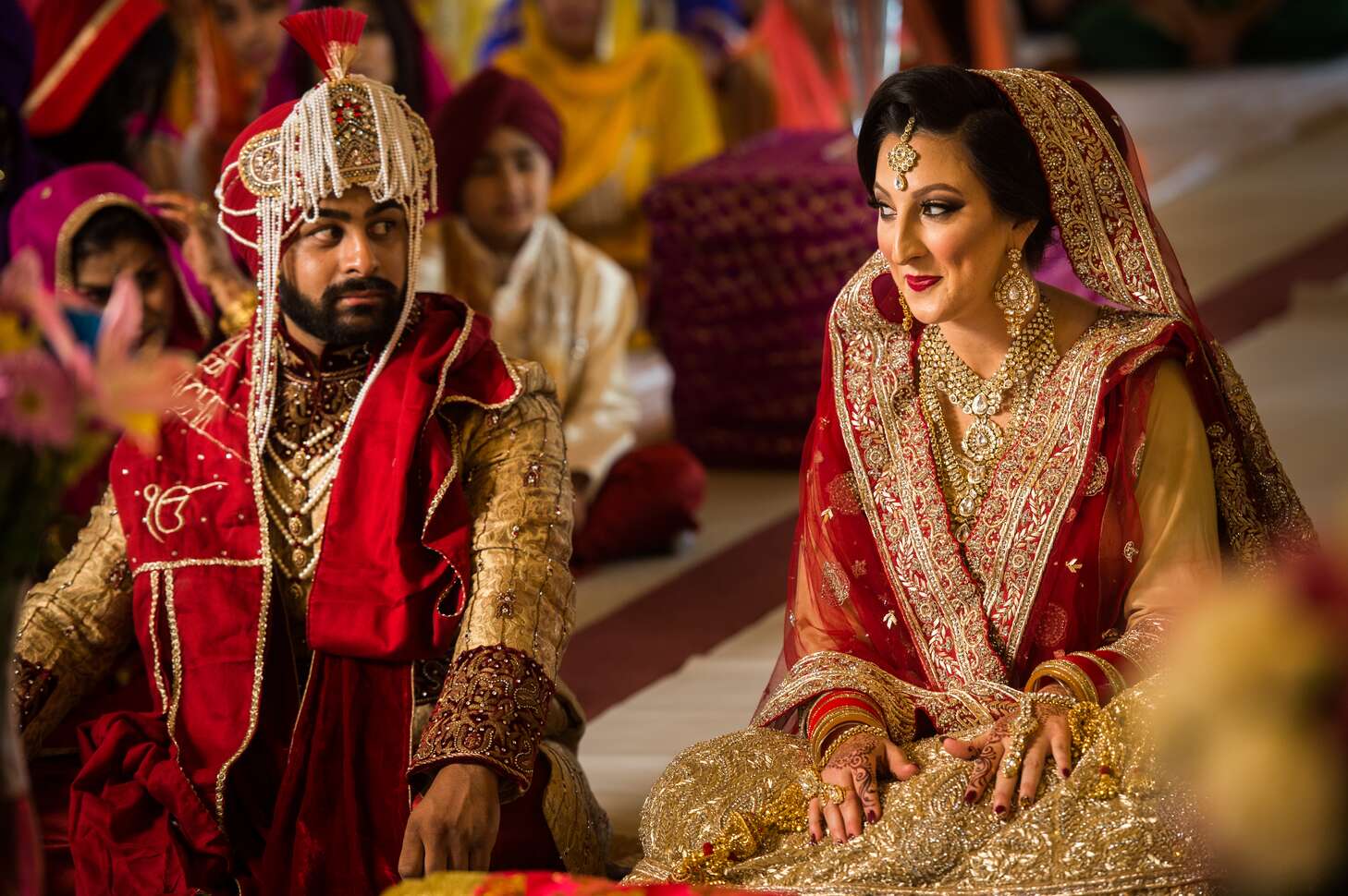 Traditional Red and Gold Punjabi Bride and Groom Attire