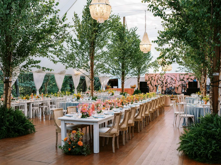 Tented wedding reception with trees