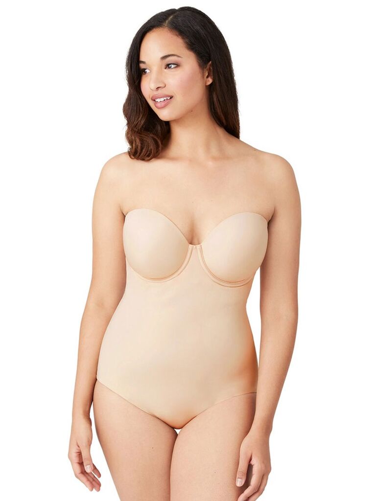 Model wearing light nude color strapless bodysuit with built-in bra wedding shapewear