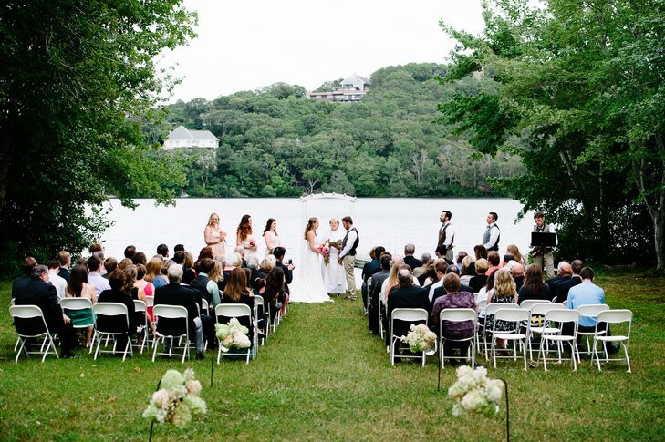 The ceremony was held in Dennis, MA in Meredith's neighbor's backyard. The outdoor space offered beautiful views of the lake, as well as acres of lush greenery.
