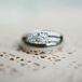 Garret gave Katie a classic round-cut diamond engagement ring. He proposed at a scenic overlook while the pair were hiking in South Korea, where they taught English.