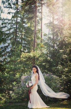 Bride in Her Own Creation and a Long Veil