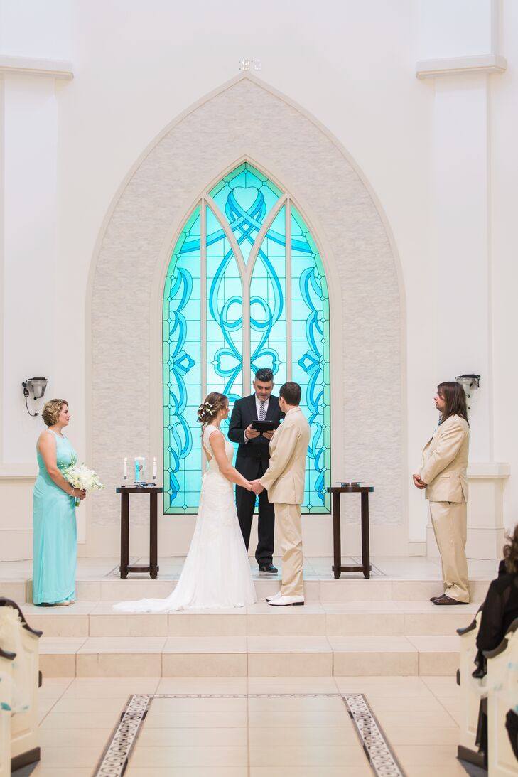 The bridesmaids stood by Cami in sweet light blue dresses with illusion halter necklines from David’s Bridal. Their pearl accessories also Cami's wedding jewelry. The groomsmen wore neutral suits from Men’s Wearhouse with Tiffany blue vests to match.