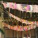 A large yarn display strung behind the sweetheart table added a homespun vibe to the couple's bold, bohemian-inspired decor. "We wanted our wedding to stand out from the norm and for our guests to feel an overwhelming sense of cheer and happiness," Courtney says.