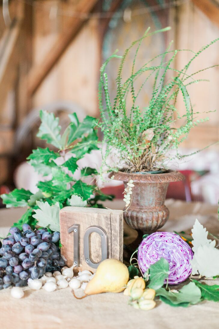 In lieu of traditional floral centerpieces, the couple filled each table with produce. "We had enough food for ourselves and our guests for a week after the wedding!" the bride says.