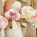 Silk ribbon, monogrammed with each bridesmaid's initials, was wrapped around their pink bouquets.