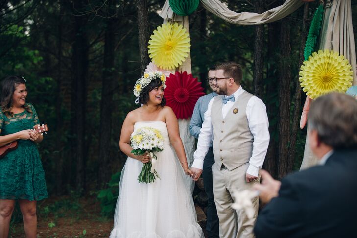 Jared went for a casual, vintage look in a tan vest suit with a chambray bow tie. His wooden boutonniere suited the woodland setting.