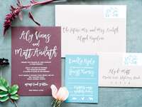 Calligraphed wedding invitation suite with properly addressed envelope