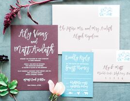 Calligraphed wedding invitation suite with properly addressed envelope
