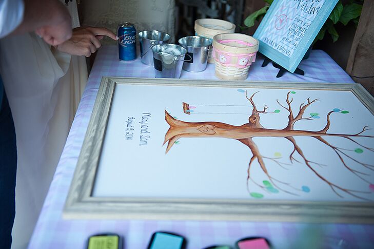 Instead of a traditional guest book, Mary and Sam had their guests leave colorful fingerprints that looked like leaves on a tree on a painted canvas.