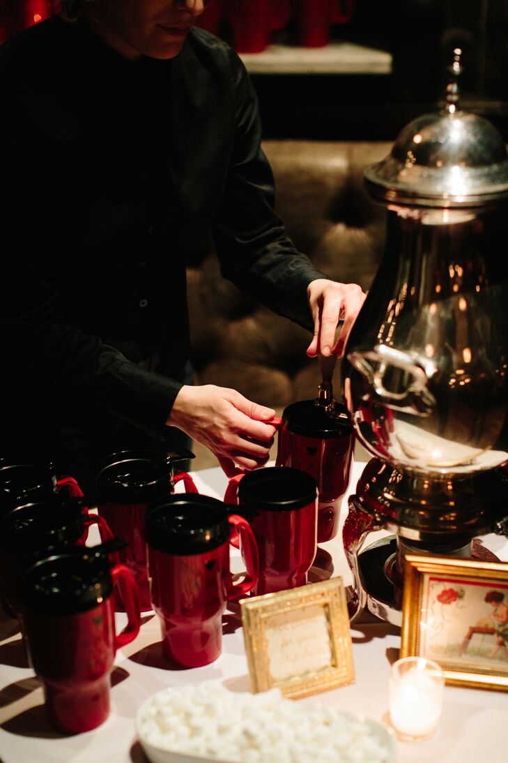 To send guests off at the end of the night, a hot cocoa station was set up with steaming hot chocolate, homemade marshmallows and the couple's red mug favors. "We wanted wedding favors that would be useful beyond just our wedding day," Allison says.