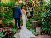 Couple walking outdoors at small wedding venue Magnolia Terrace in Frisco, Texas