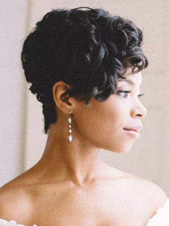 Bride wears her hair in loose natural curls. 