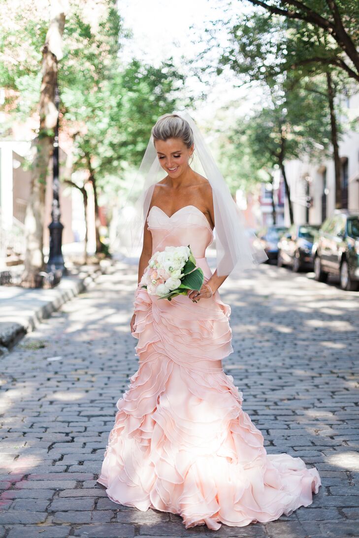 Cecilia wore a custom-made, pink dress designed by Project Runway winner Leanne Marshall. "I knew I wanted pink and that it had to be unique," Cecilia says. "I wanted it to make more of a fashion statement than a traditional wedding dress would."