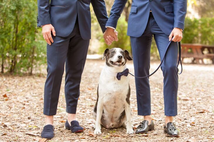 Renato and Patrick had their navy tuxedos tailored to be slightly shorter. "We decided to have them tailored and cropped since we wanted to wear loafers," Renato says. Their dog—outfitted in a bow tie as well—was part of the wedding procession.