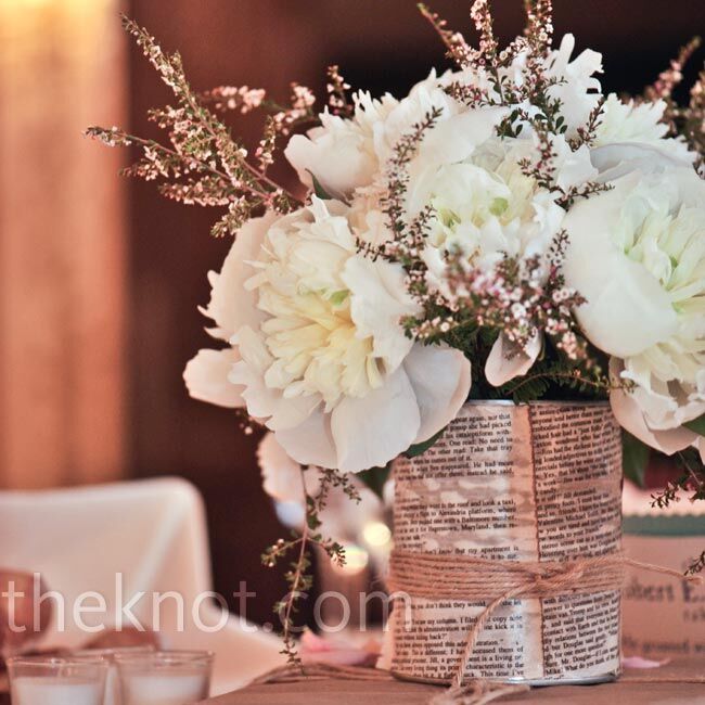 Flowers were placed in tins that Andrew decoupaged with aged paper. Paper-covered books brought in the literary theme.