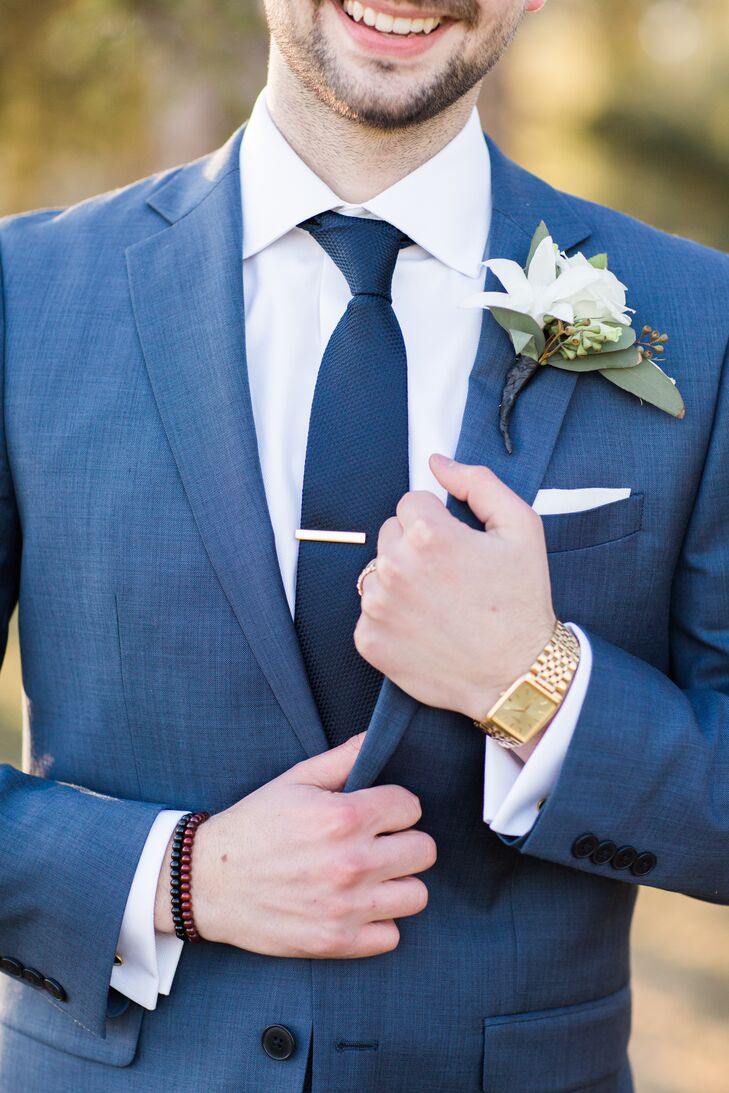 Even the groom stuck with a "something old" mantra  by pairing used cuff links with a blue suit, wine-colored Aldo shoes (something new) and a gold wristwatch borrowed from his grandfather. "Girls aren't the only ones who get to have fun with the accessories," he says.