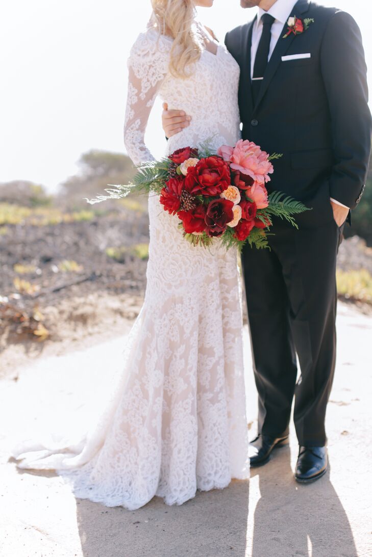 Carlie's sleeved wedding gown and bouquet of deep oxblood blooms created a dramatic, slightly vintage bridal look.