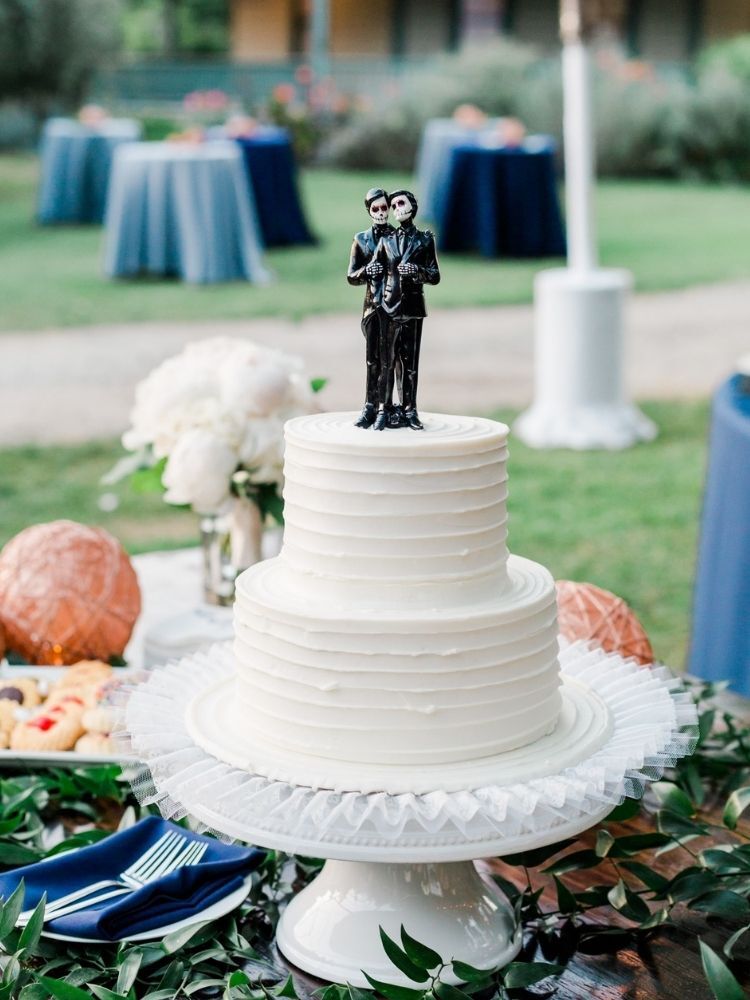 wedding cake with Day of the Dead-inspired cake topper