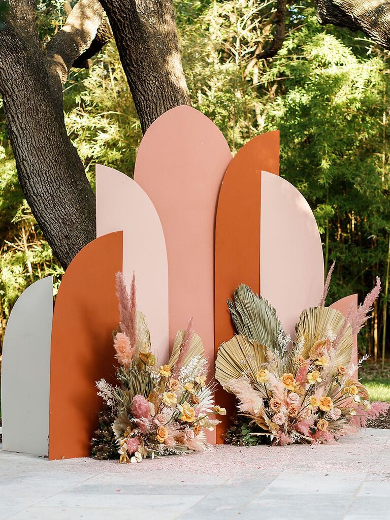 Modern clay-colored backdrop with floral accents