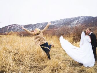 bridesmaid jumps out of wedding photo