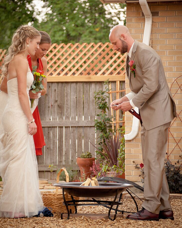 “We had everyone take a handful of red cedar wood chips as they walked through the house to their seats,” Sharon says. “During the ceremony we had everyone make a simple wish or thought toward our marriage and then my cousins went around and collected them in baskets. We put all the wood chips in a fire that Eric and I had started off to the side of the ceremony and it symbolized how Eric and I may have started this fiery loving relationship but it was also our friends and family who have supported us throughout the years and helped us be the passionate, happy couple we are today.”