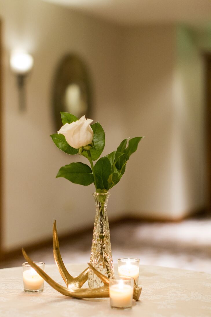 A gilded antler added a rustic touch to the tables at Emily and Chris' cocktail hour.