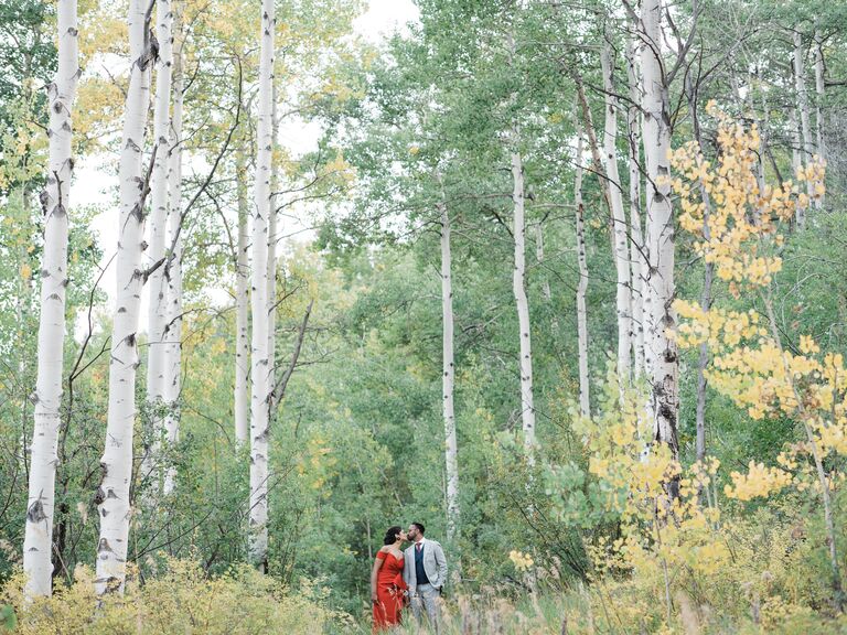Long distance photoshoot in a forest with the engaged couple